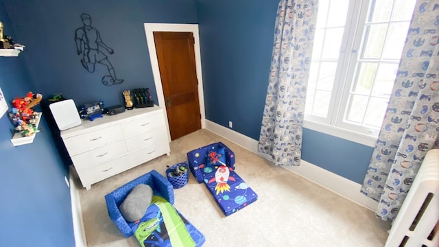 carpeted bedroom with multiple windows