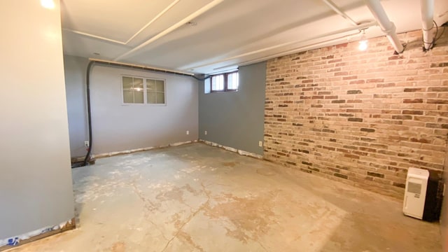 below grade area featuring brick wall