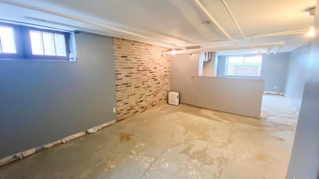 basement with brick wall