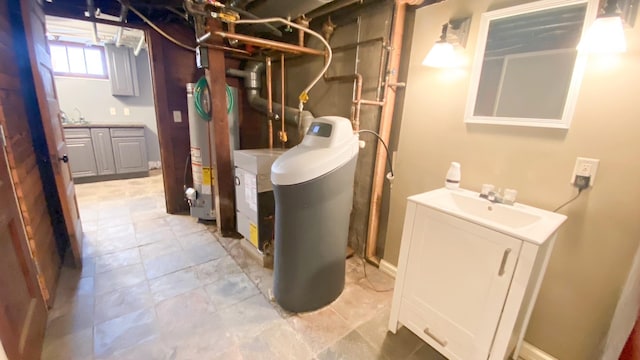 utilities featuring water heater and a sink