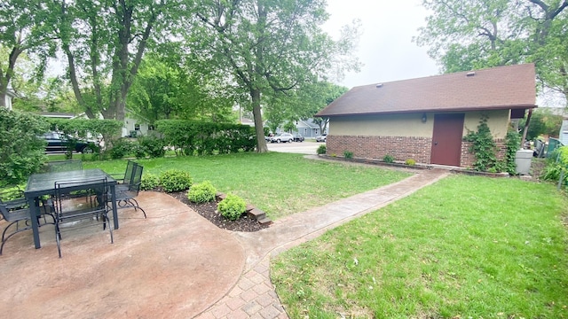 1201 6th Ave, Worthington, MN 56187 - view of grassy yard with a patio area and outdoor dining area