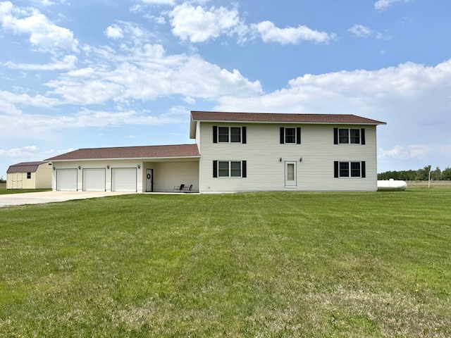 32661 County Road 16, Ross, MN 56751 - colonial inspired home featuring driveway, a front yard, and a garage
