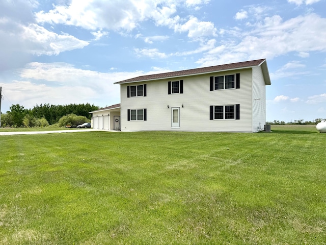 32661 County Road 16, Ross, MN 56751 - view of front facade featuring a front lawn, an attached garage, and central air condition unit