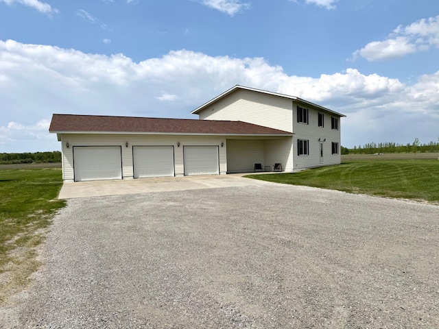32661 County Road 16, Ross, MN 56751 - view of front of property with asphalt driveway, a front yard, and a garage