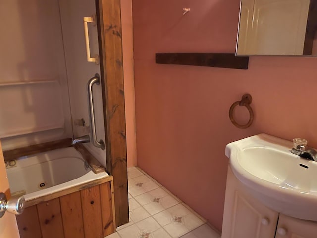 40884 Nature Ave, Fleming Twp, MN 56431 - full bathroom with tile patterned flooring, a combined bath / shower with jetted tub, and vanity