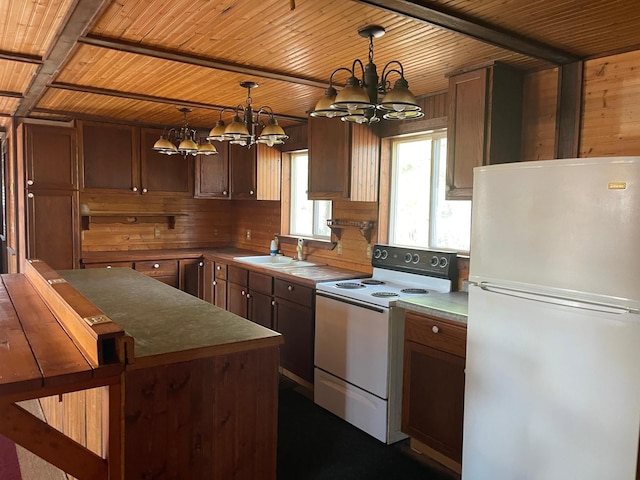 40884 Nature Ave, Fleming Twp, MN 56431 - kitchen with white appliances, a chandelier, wood ceiling with exposed beams, a sink, and pendant lighting