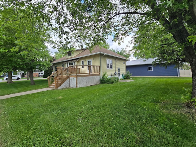 421 7th Ave SE, Pipestone, MN 56164 - view of front of house featuring a deck, a front lawn, and stairs