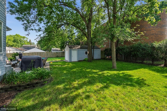 4022 Yosemite Ave S, Saint Louis Park, MN 55416 - view of yard featuring a storage shed, an outbuilding, and a fenced backyard