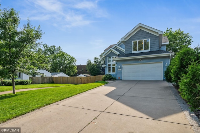 4022 Yosemite Ave S, Saint Louis Park, MN 55416 - view of front of house with a front lawn, driveway, an attached garage, fence, and roof with shingles