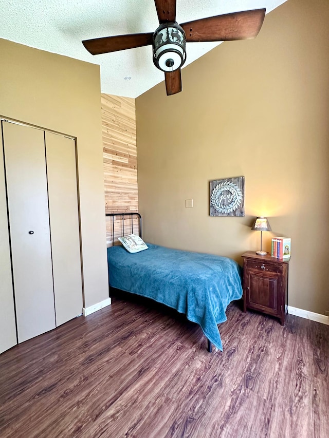 38985 337th Ln, Aitkin, MN 56431 - bedroom with high vaulted ceiling, wood finished floors, baseboards, a closet, and a ceiling fan