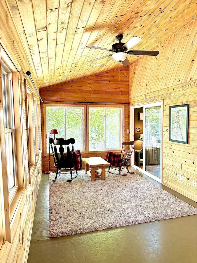 38985 337th Ln, Aitkin, MN 56431 - living area with wooden walls, lofted ceiling, ceiling fan, and wood ceiling