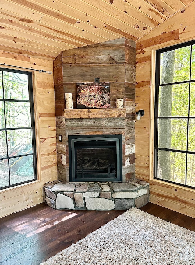 38985 337th Ln, Aitkin, MN 56431 - detailed view of wooden walls, a stone fireplace, wood finished floors, and wooden ceiling