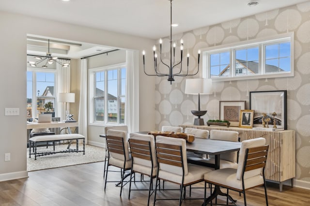 1331 150th St W, Rosemount, MN 55068 - dining space featuring baseboards, an inviting chandelier, a wealth of natural light, and wood finished floors