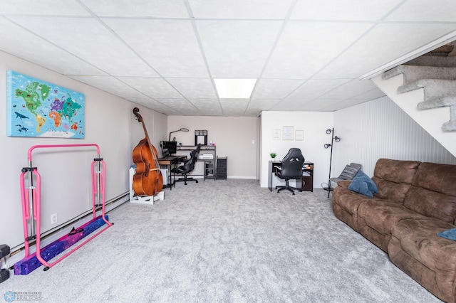 living room featuring a drop ceiling, stairway, and carpet floors