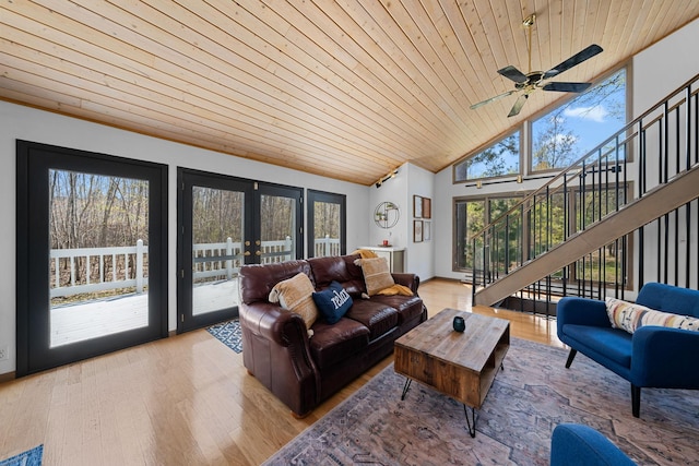 3626 Bay Dr, Danbury, WI 54830 - living area with french doors, wood ceiling, light wood-style floors, stairway, and high vaulted ceiling