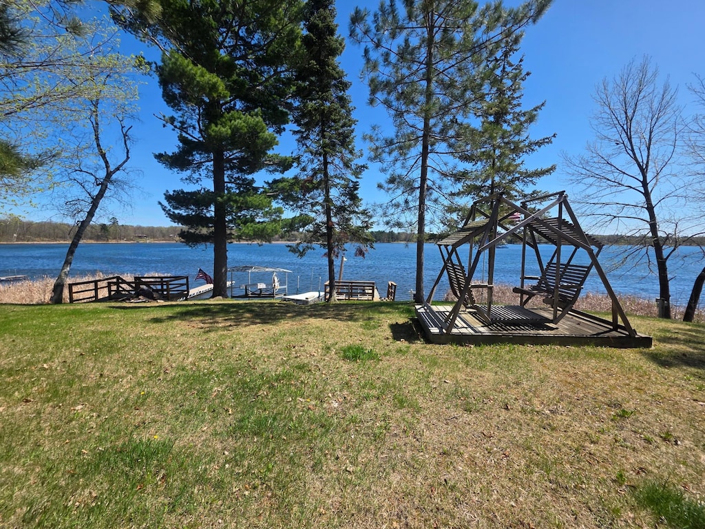 4725 Shangri La Dr NE, Longville, MN 56655 - view of grassy yard with a water view and a dock