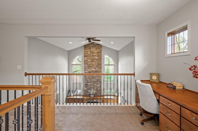 home office with ceiling fan, carpet, and lofted ceiling