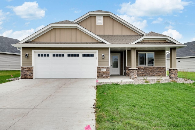 10017 177th Ave NW, Elk River, MN 55330 - craftsman-style house with stone siding, a garage, a front lawn, driveway, and roof with shingles