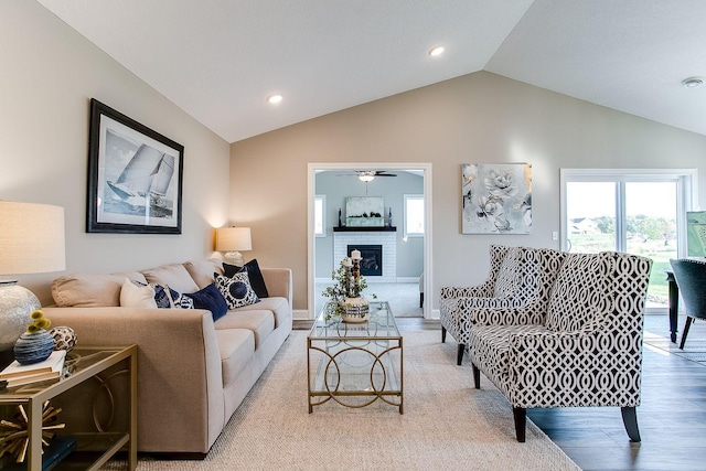 10017 177th Ave NW, Elk River, MN 55330 - living area featuring light wood-type flooring, a ceiling fan, vaulted ceiling, and a wealth of natural light