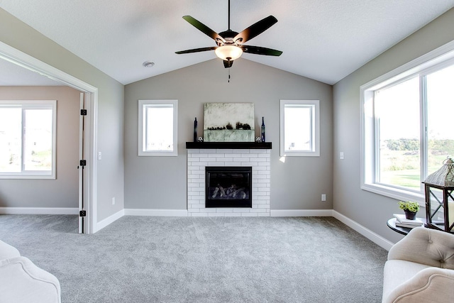 10017 177th Ave NW, Elk River, MN 55330 - unfurnished living room with a wealth of natural light, carpet, and a brick fireplace