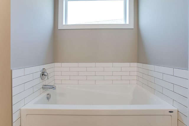 10017 177th Ave NW, Elk River, MN 55330 - full bathroom featuring a bath and a healthy amount of sunlight