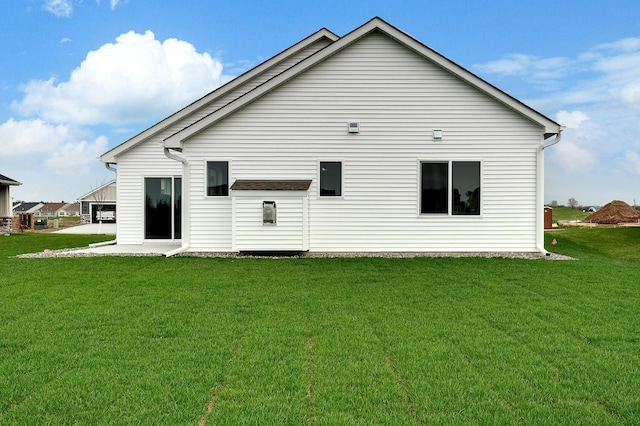 10017 177th Ave NW, Elk River, MN 55330 - back of property with a patio area and a lawn