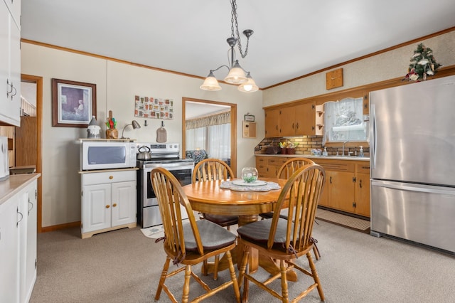 42271 Vista Road, East Side Twp, MN 56342 - dining room with light carpet, ornamental molding, and healthy amount of natural light