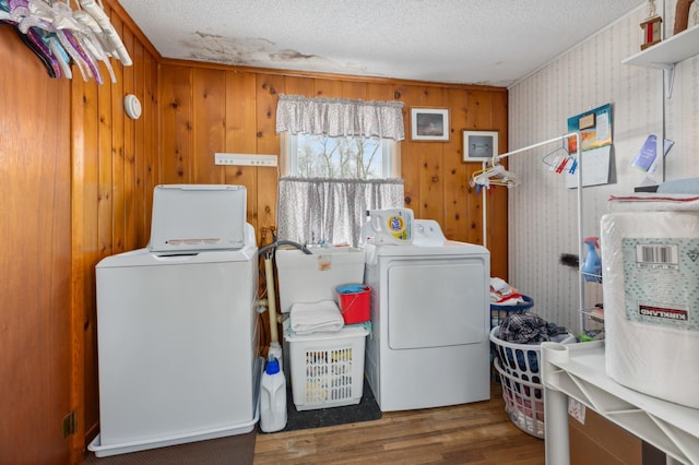 42271 Vista Road, East Side Twp, MN 56342 - laundry room with washing machine and dryer, wood finished floors, and a textured ceiling