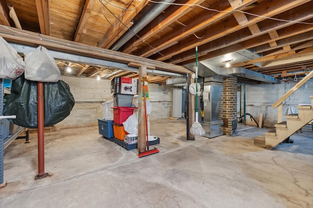 42271 Vista Road, East Side Twp, MN 56342 - unfinished basement with water heater, stairs, and heating unit