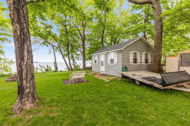 42271 Vista Road, East Side Twp, MN 56342 - view of grassy yard featuring a water view and an outbuilding