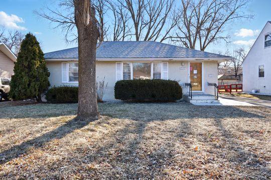 7335 Penn Ave S, Richfield, MN 55423 - view of front facade with entry steps and stucco siding