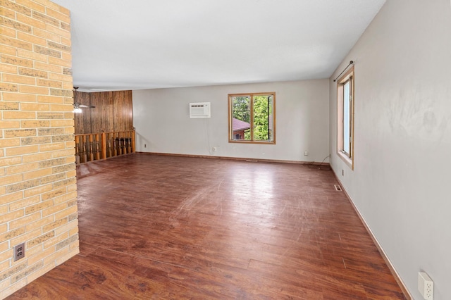 409 Dale Dr SE, Remer, MN 56672 - spare room featuring wood finished floors and a wall mounted AC