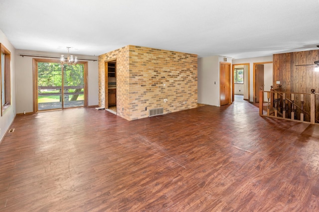 409 Dale Dr SE, Remer, MN 56672 - unfurnished living room featuring a chandelier and wood finished floors
