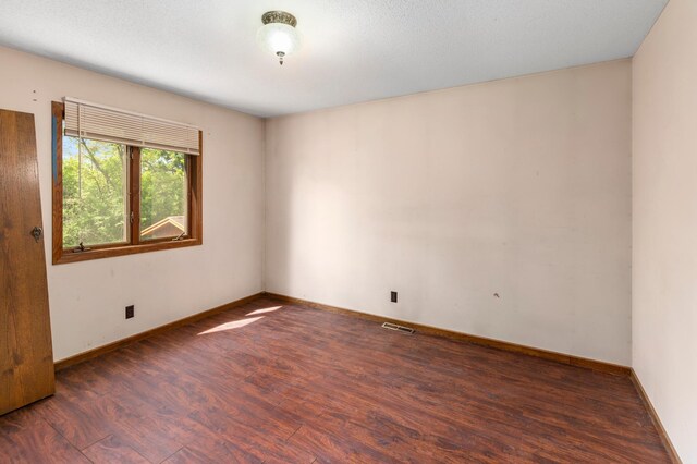 409 Dale Dr SE, Remer, MN 56672 - unfurnished room with wood finished floors and baseboards