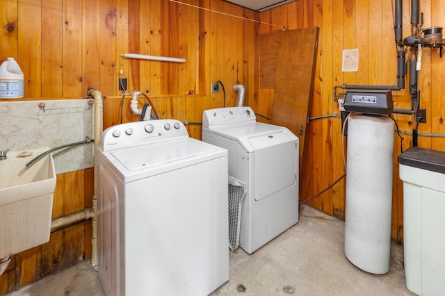 409 Dale Dr SE, Remer, MN 56672 - laundry room featuring separate washer and dryer and wood walls