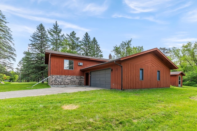 409 Dale Dr SE, Remer, MN 56672 - view of side of home with an attached garage, driveway, a yard, and a chimney