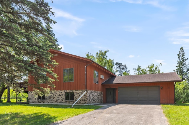 409 Dale Dr SE, Remer, MN 56672 - view of front of home with driveway, an attached garage, and a front lawn