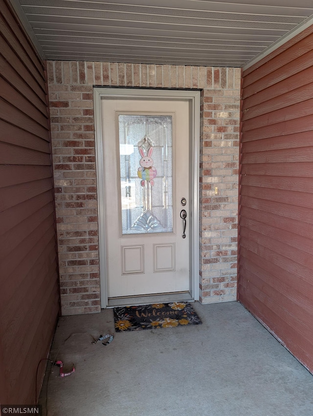 902 Meadow Lark Ln, Long Prairie, MN 56347 - view of exterior entry with brick siding