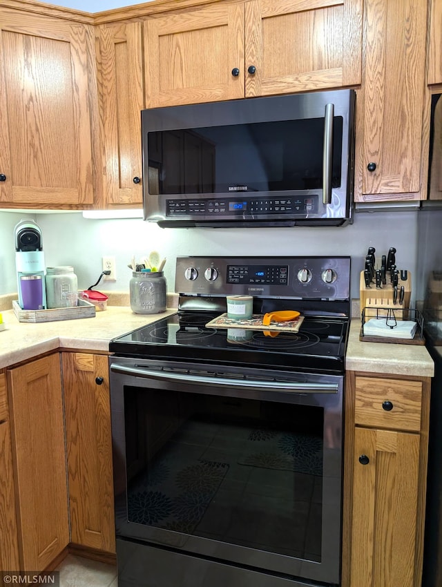 902 Meadow Lark Ln, Long Prairie, MN 56347 - kitchen with appliances with stainless steel finishes and light countertops