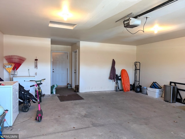 902 Meadow Lark Ln, Long Prairie, MN 56347 - garage featuring a garage door opener and washer / dryer