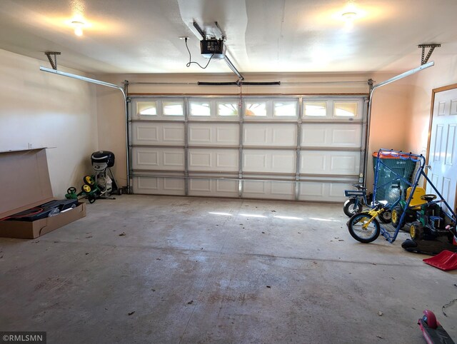 902 Meadow Lark Ln, Long Prairie, MN 56347 - garage with a garage door opener
