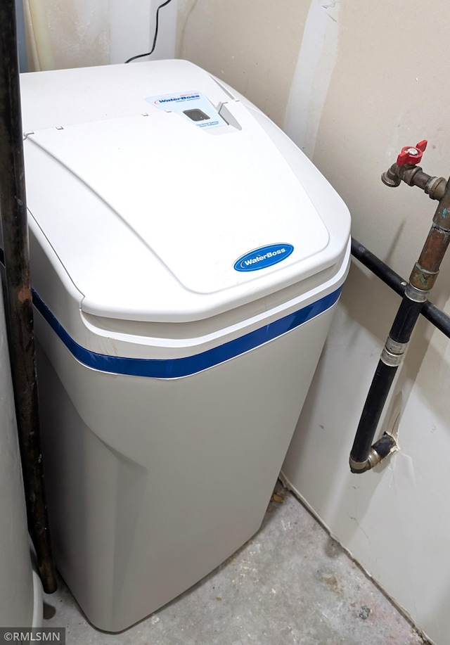 902 Meadow Lark Ln, Long Prairie, MN 56347 - detailed view of a water softener system and unfinished concrete floors