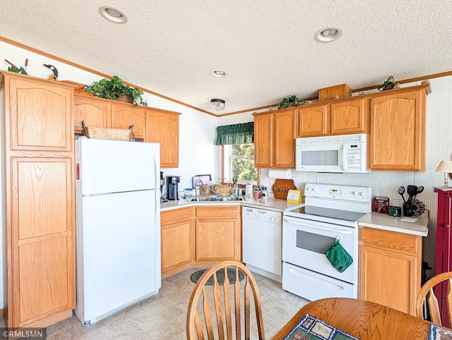 kitchen featuring vaulted ceiling, white appliances, light countertops, a textured ceiling, and a sink