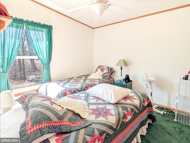 bedroom with crown molding, baseboards, a ceiling fan, and carpet