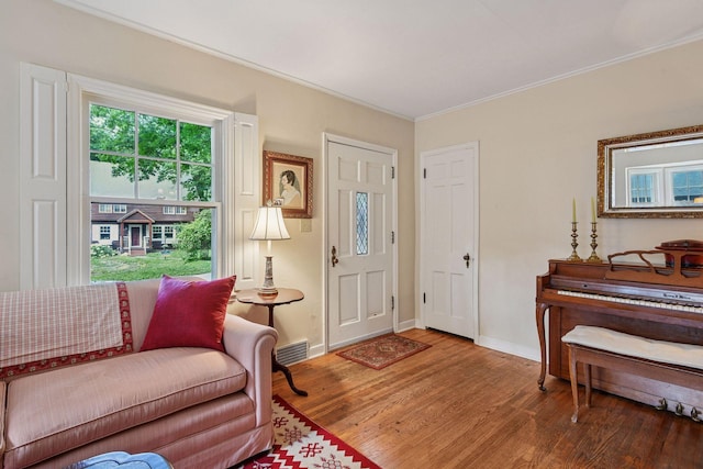 19135 Highland Ave, Deephaven, MN 55391 - entryway with wood finished floors, crown molding, and healthy amount of natural light