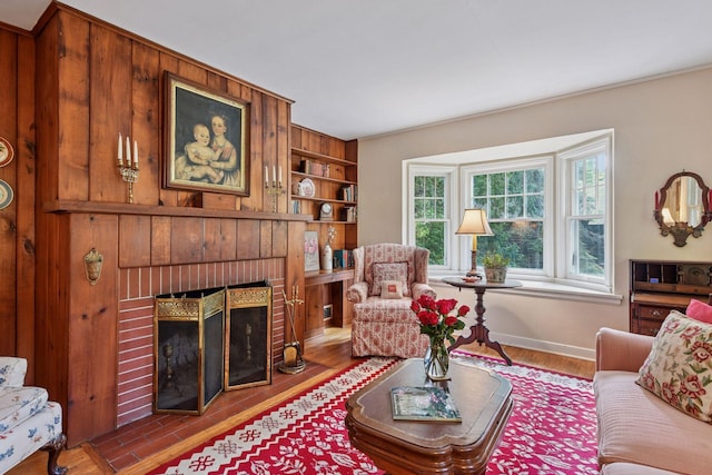 19135 Highland Ave, Deephaven, MN 55391 - living room with a fireplace, wood finished floors, and built in shelves