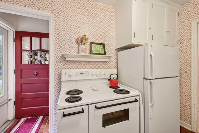 19135 Highland Ave, Deephaven, MN 55391 - kitchen featuring white appliances, white cabinetry, light countertops, and wallpapered walls