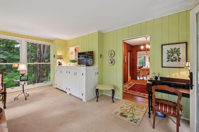19135 Highland Ave, Deephaven, MN 55391 - living room with light carpet, a chandelier, and crown molding
