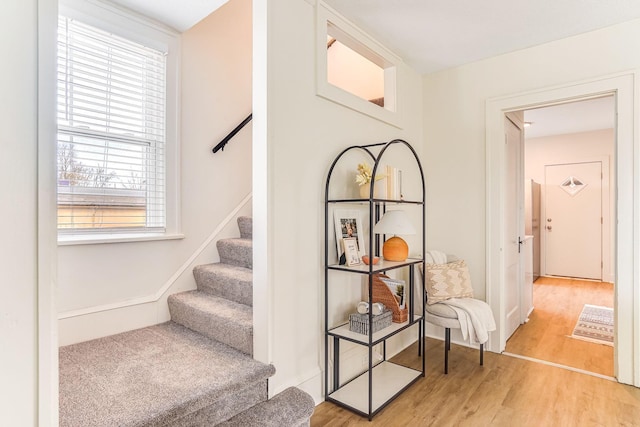 stairway with wood finished floors