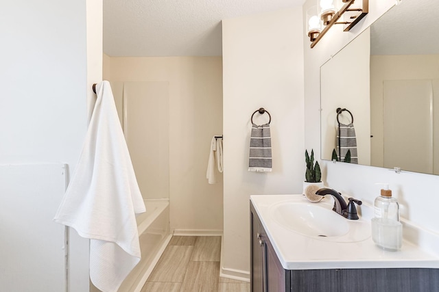 bathroom featuring vanity and baseboards